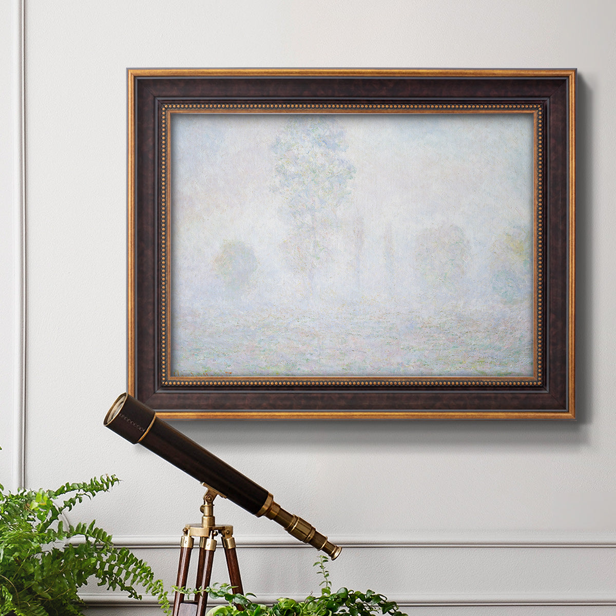 Impressionist atmospheric landscape in morning haze by Claude Monet in an ornate bronzed mahogany wood frame displayed in a light-toned interior setting.