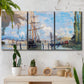 Three-panel canvas wall art featuring busy river port scene, displayed in a boho-chic entryway above a console table.