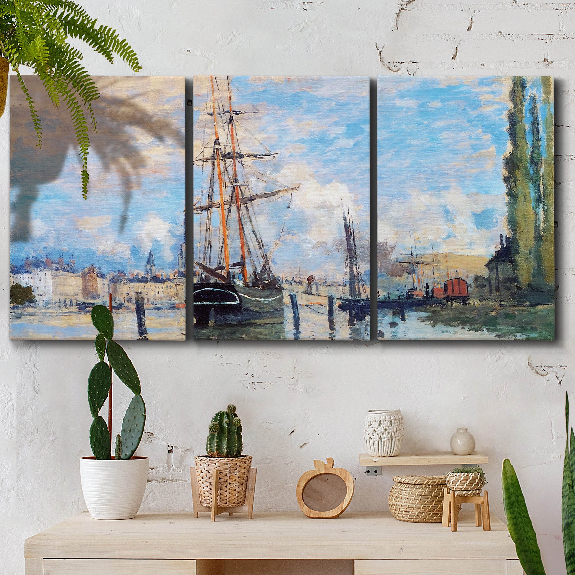 Three-panel canvas wall art featuring busy river port scene, displayed in a boho-chic entryway above a console table.