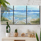 Three-panel canvas wall art featuring peaceful coastal landscape escape, displayed in a boho-chic entryway above a console table.