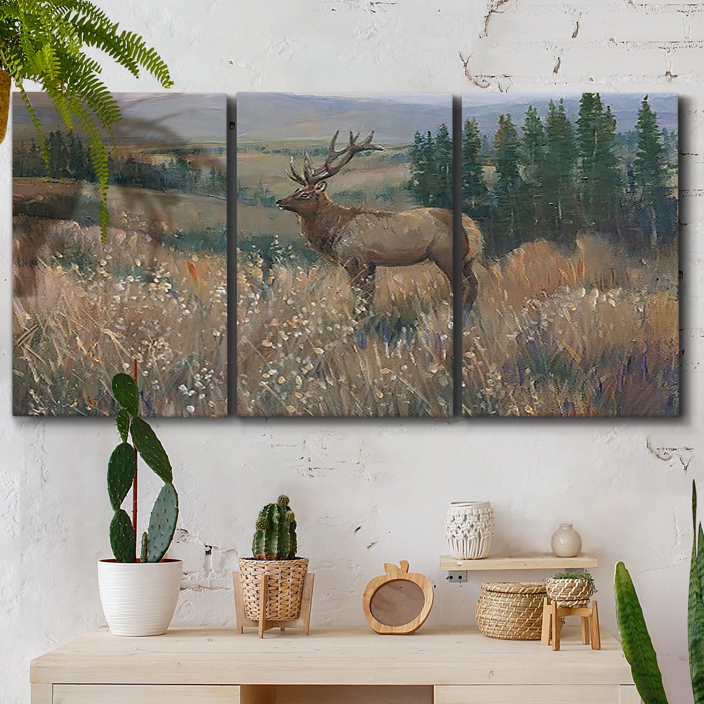 Three-panel canvas wall art featuring western wildlife standing in grassland, displayed in a boho-chic entryway above a console table.