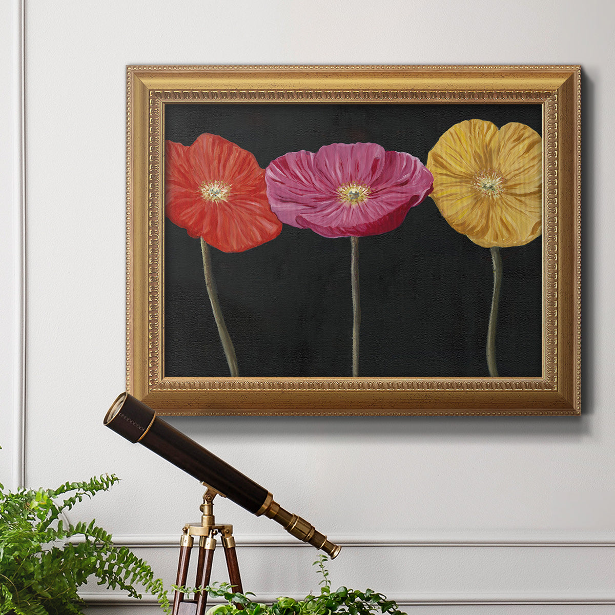 Contemporary poppy flower artwork in an ornate antique gold frame displayed in a light-toned interior setting.