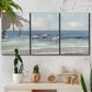 Three-panel canvas wall art featuring shore birds searching along beach, displayed in a boho-chic entryway above a console table.