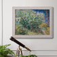 Impressionist lilac flower painting by Vincent van Gogh in an ornate weathered white frame displayed in a light-toned interior setting.