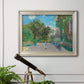 Impressionist residential landscape at Argenteuil by Claude Monet in an ornate champagne frame displayed in a light-toned interior setting.