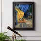 Impressionist night café street scene by Vincent van Gogh in an ornate black frame with gilded inner detail displayed in a light-toned interior setting.