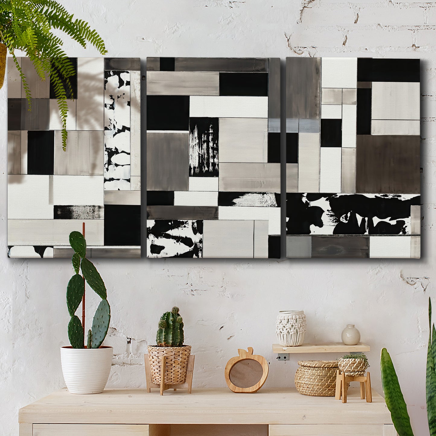 Three-panel canvas wall art featuring rectangular mid century geometric abstraction, displayed in a boho-chic entryway above a console table.