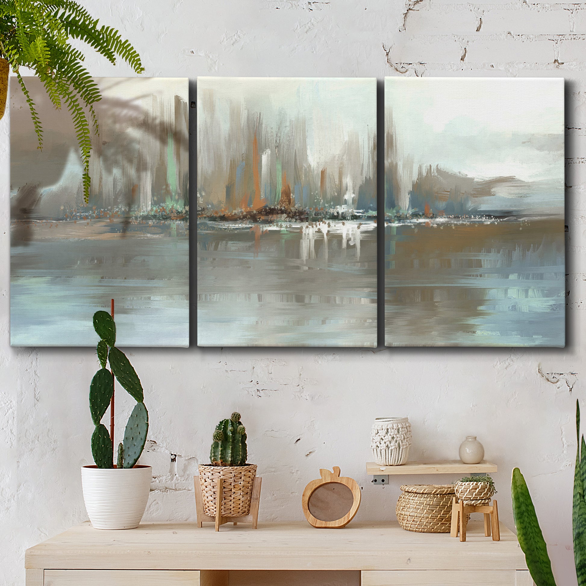 Three-panel canvas wall art featuring glowing abstract city lights, displayed in a boho-chic entryway above a console table.