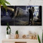 Three-panel canvas wall art featuring couple kissing at train station, displayed in a boho-chic entryway above a console table.