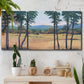 Three-panel canvas wall art featuring quiet morning landscape with trees, displayed in a boho-chic entryway above a console table.