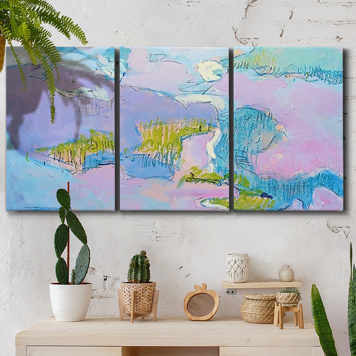 Three-panel canvas wall art featuring abstract view through window forms, displayed in a boho-chic entryway above a console table.