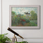 Impressionist garden landscape at Argenteuil by Claude Monet in an ornate weathered white frame displayed in a light-toned interior setting.