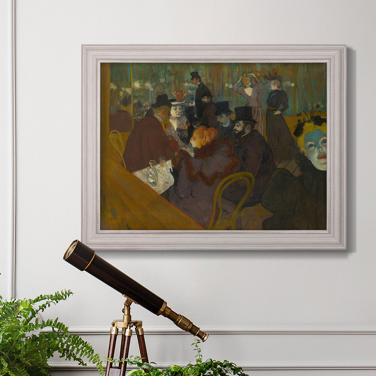 Impressionist cabaret interior scene by Henri de Toulouse-Lautrec in an ornate weathered white frame displayed in a light-toned interior setting.