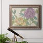 Contemporary peony flower illustration in an ornate traditional silver frame displayed in a light-toned interior setting.
