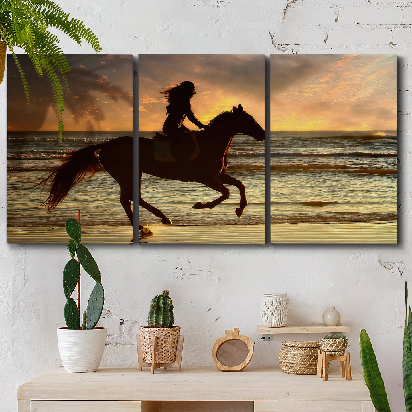 Three-panel canvas wall art featuring running horse along beach photograph, displayed in a boho-chic entryway above a console table.