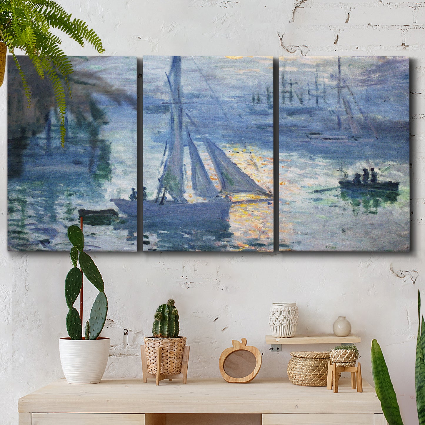 Three-panel canvas wall art featuring sailboats racing on river, displayed in a boho-chic entryway above a console table.