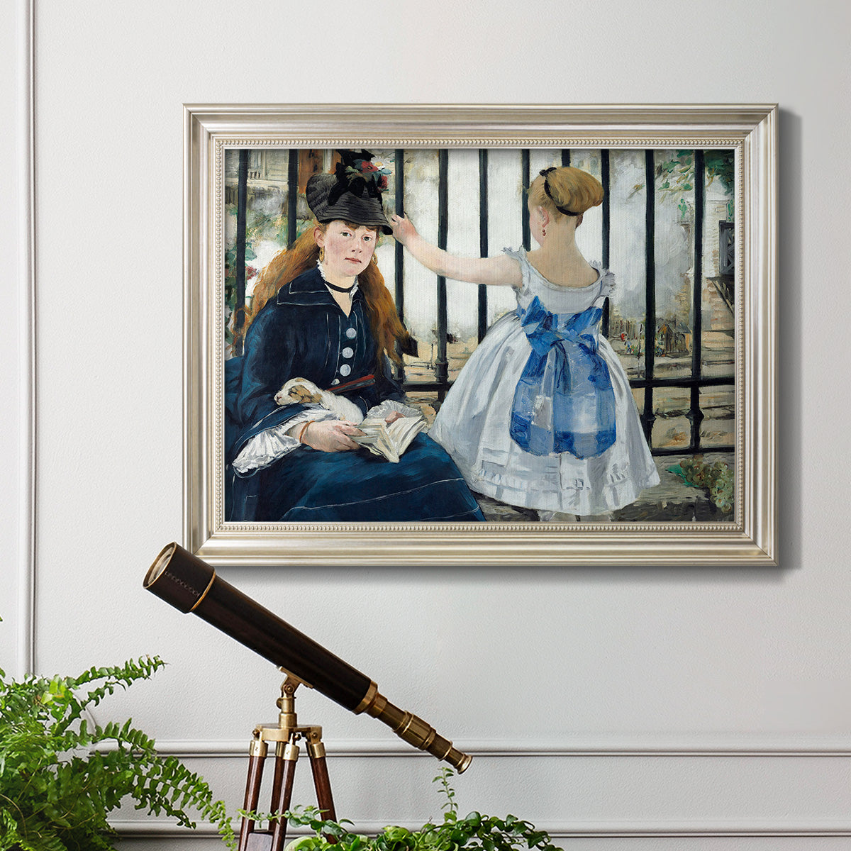 Impressionist urban scene near a railway by Édouard Manet in an ornate champagne frame displayed in a light-toned interior setting.