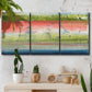 Three-panel canvas wall art featuring layered abstract color banding, displayed in a boho-chic entryway above a console table.