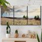 Three-panel canvas wall art featuring wildflowers across tuscan landscape, displayed in a boho-chic entryway above a console table.
