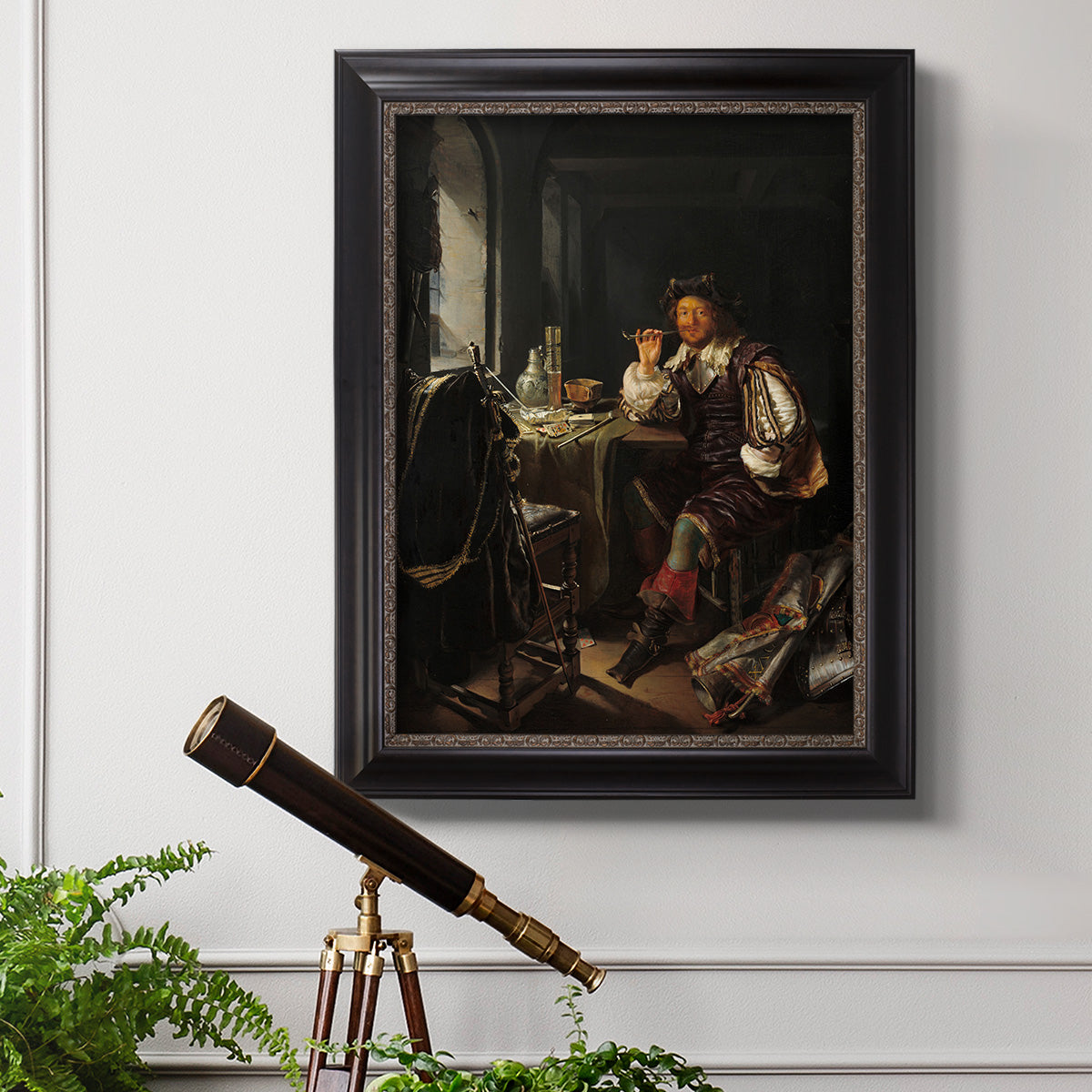 Classical portrait of a soldier smoking a pipe by Frans van Mieris the Elder in an ornate black frame with gilded inner detail displayed in a light-toned interior setting.