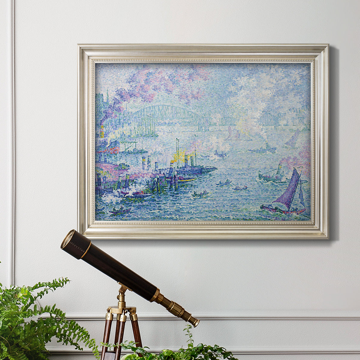 Impressionist industrial harbor scene by Paul Signac in an ornate champagne frame displayed in a light-toned interior setting.