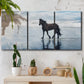 Three-panel canvas wall art featuring running horses captured mid stride, displayed in a boho-chic entryway above a console table.