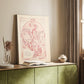 Canvas art print of a stylized female figure surrounded by blossoms and gentle tones styled in a home decor setting.