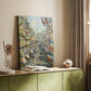 Canvas art print of a festive city street filled with movement and color styled in a home decor setting.