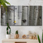 Three-panel canvas wall art featuring close up tree bark texture photograph, displayed in a boho-chic entryway above a console table.