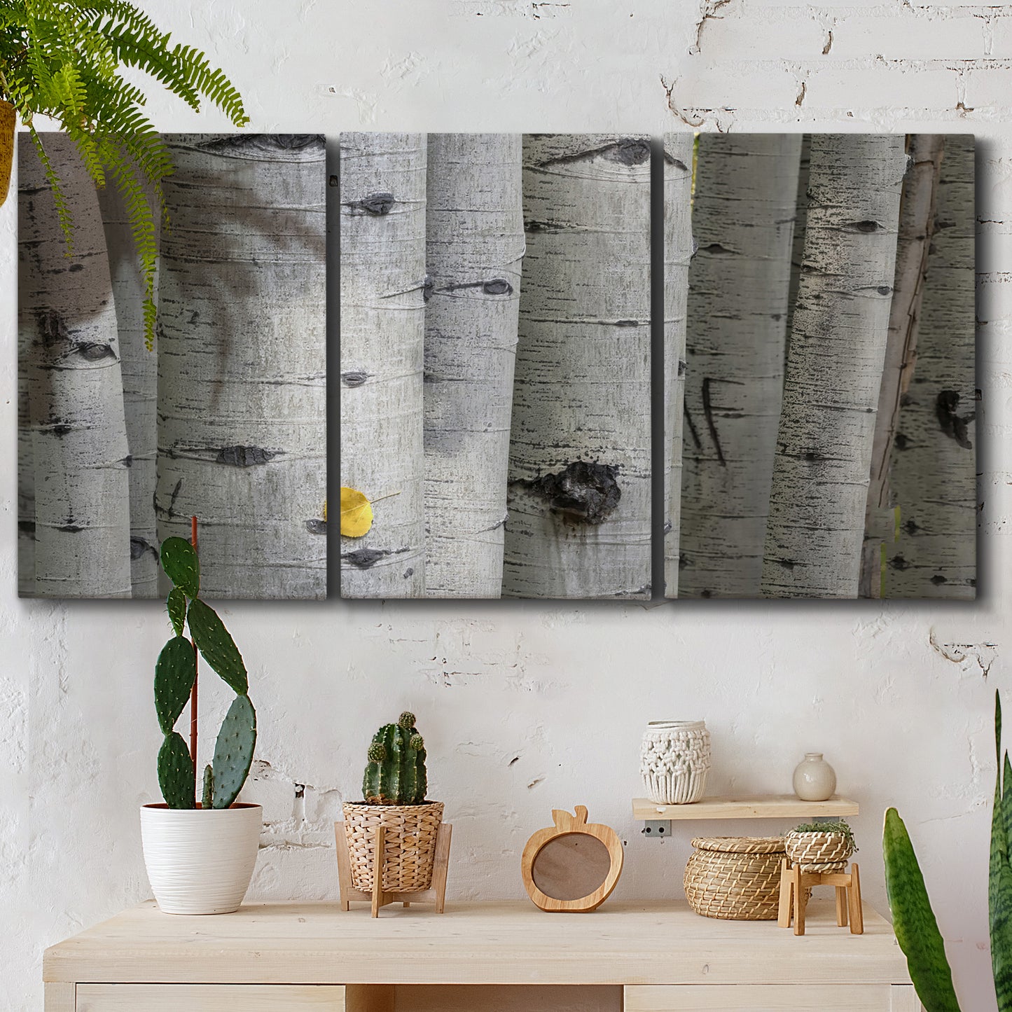 Three-panel canvas wall art featuring close up tree bark texture photograph, displayed in a boho-chic entryway above a console table.