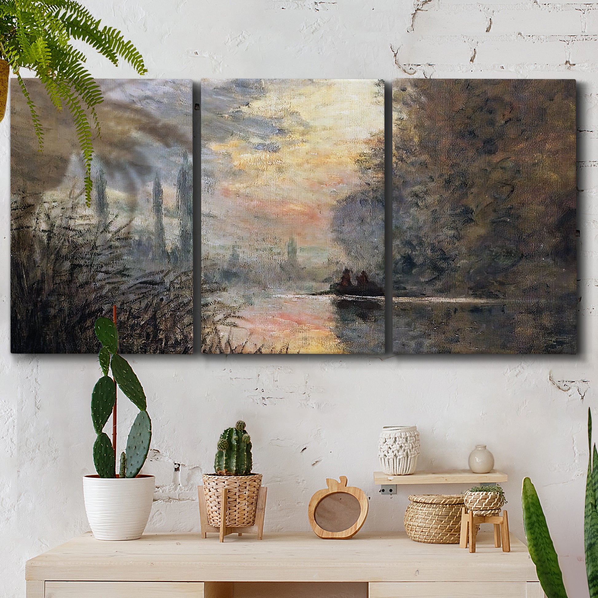 Three-panel canvas wall art featuring winter river sunset with reflections, displayed in a boho-chic entryway above a console table.
