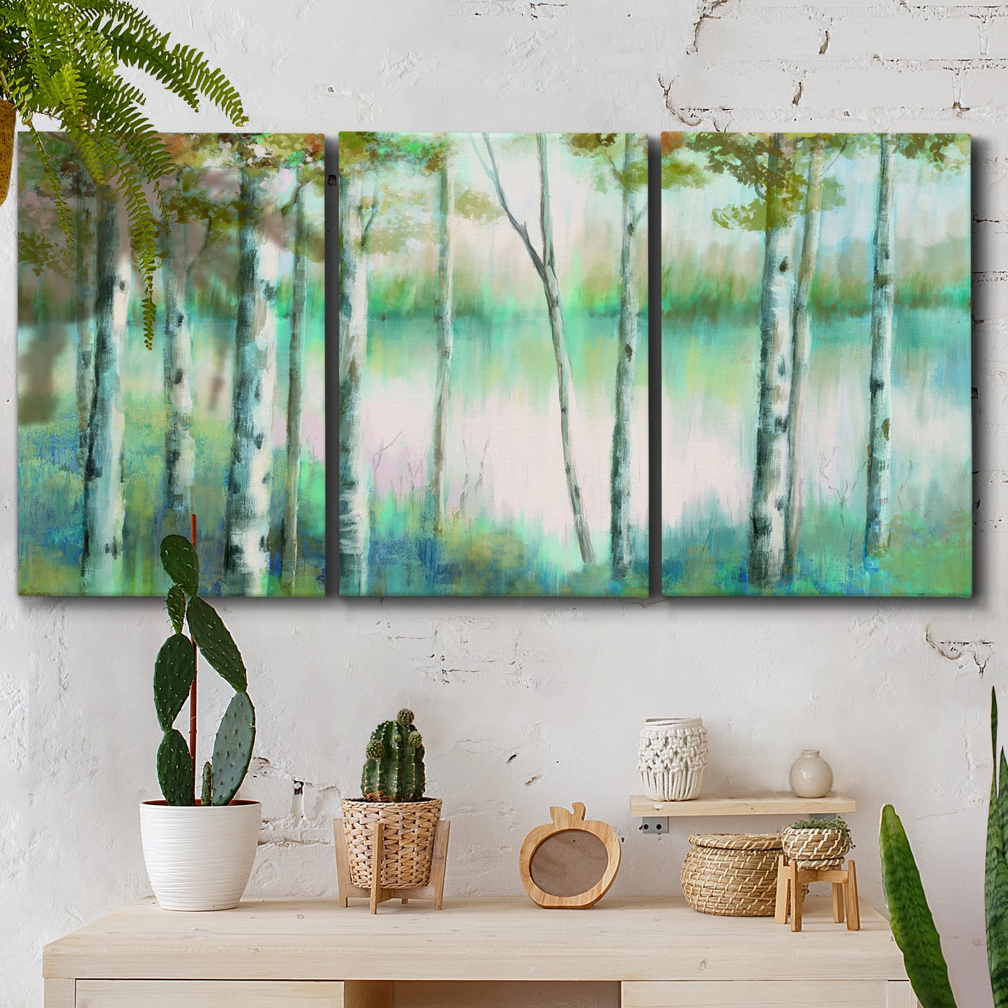 Three-panel canvas wall art featuring calm lake framed by aspen trees, displayed in a boho-chic entryway above a console table.