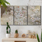 Three-panel canvas wall art featuring early spring blossoms in soft tones, displayed in a boho-chic entryway above a console table.