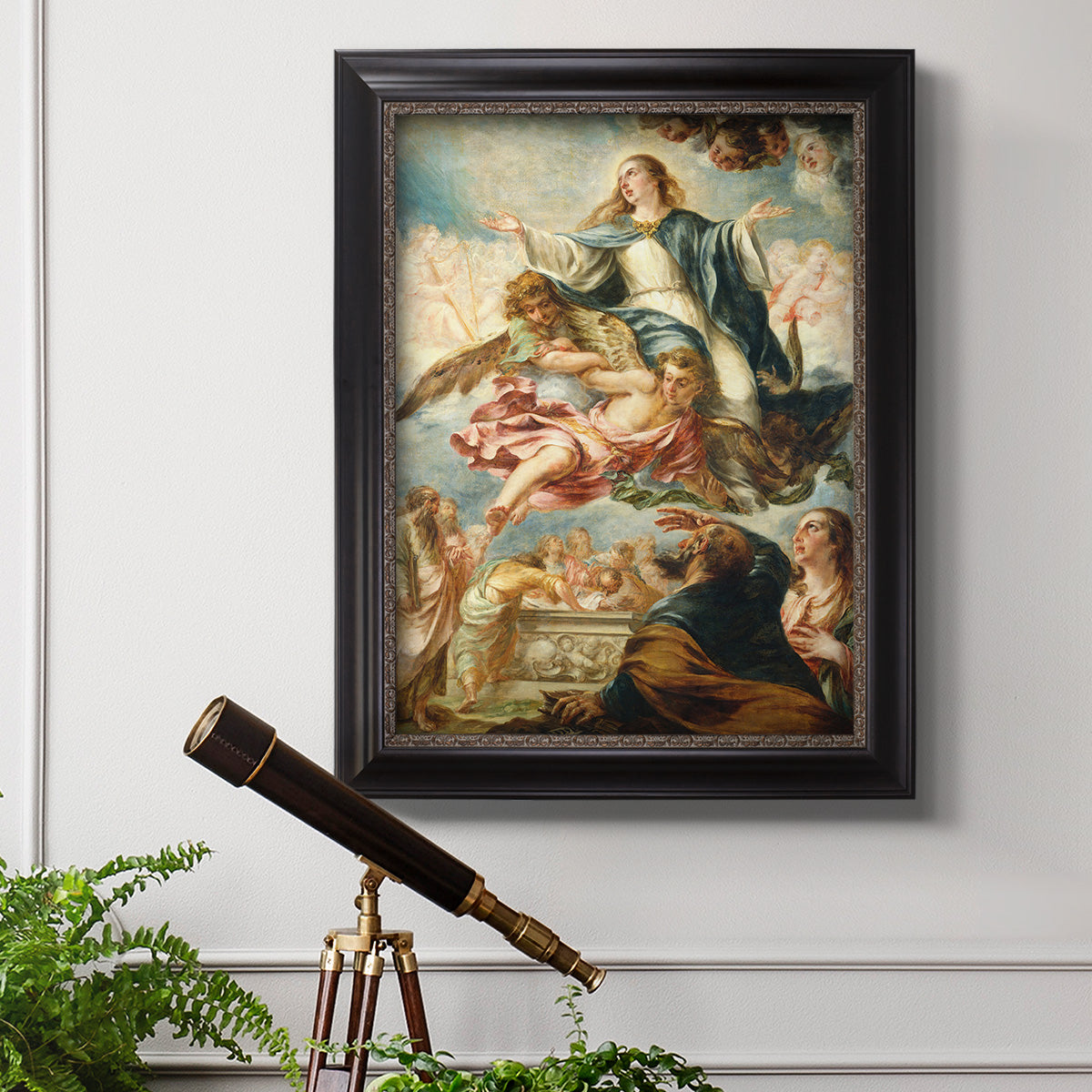 Religious painting of the Assumption of the Virgin Mary by Juan de Valdés Leal in an ornate black frame with gilded inner detail displayed in a light-toned interior setting.
