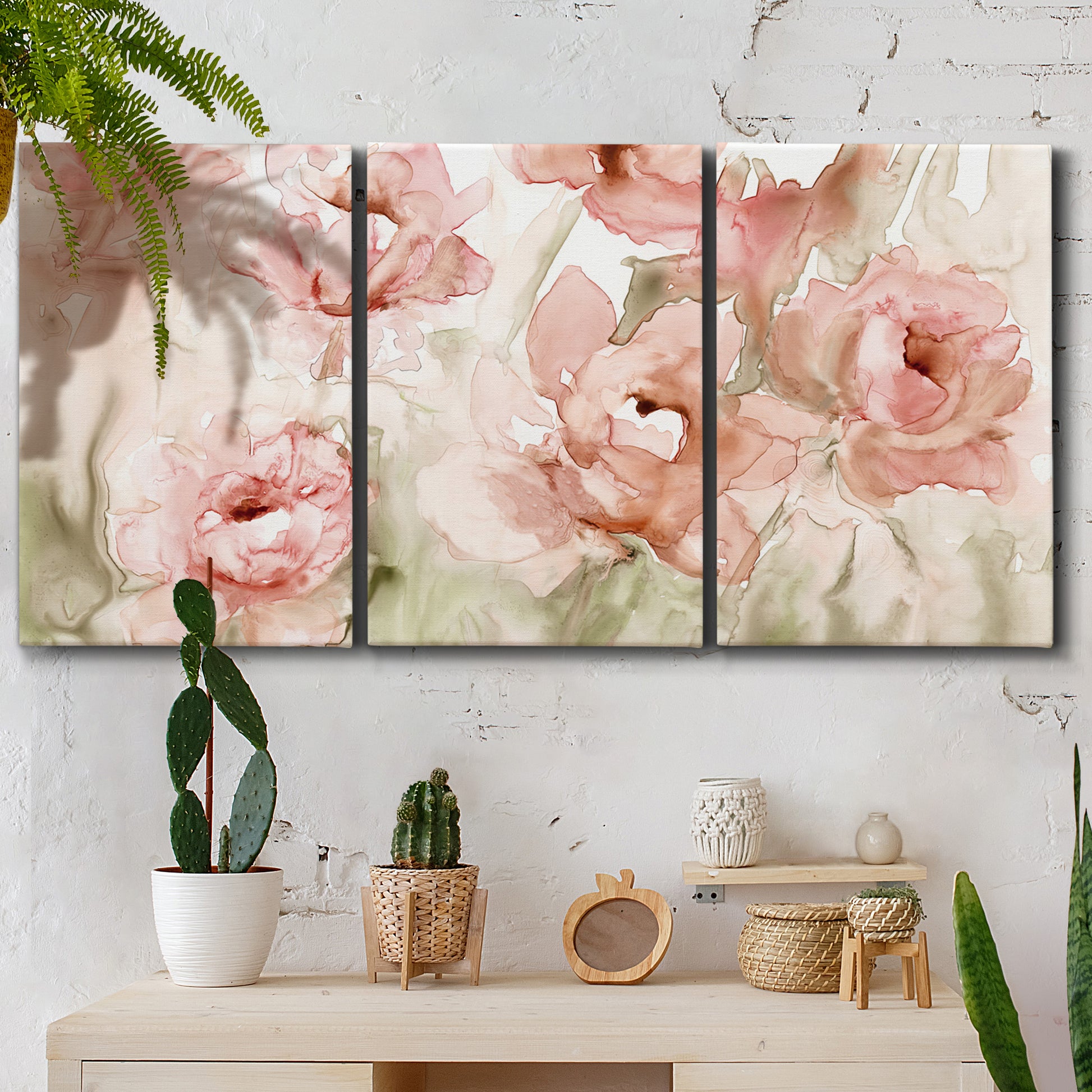 Three-panel canvas wall art featuring spring floral blossoms in bloom, displayed in a boho-chic entryway above a console table.