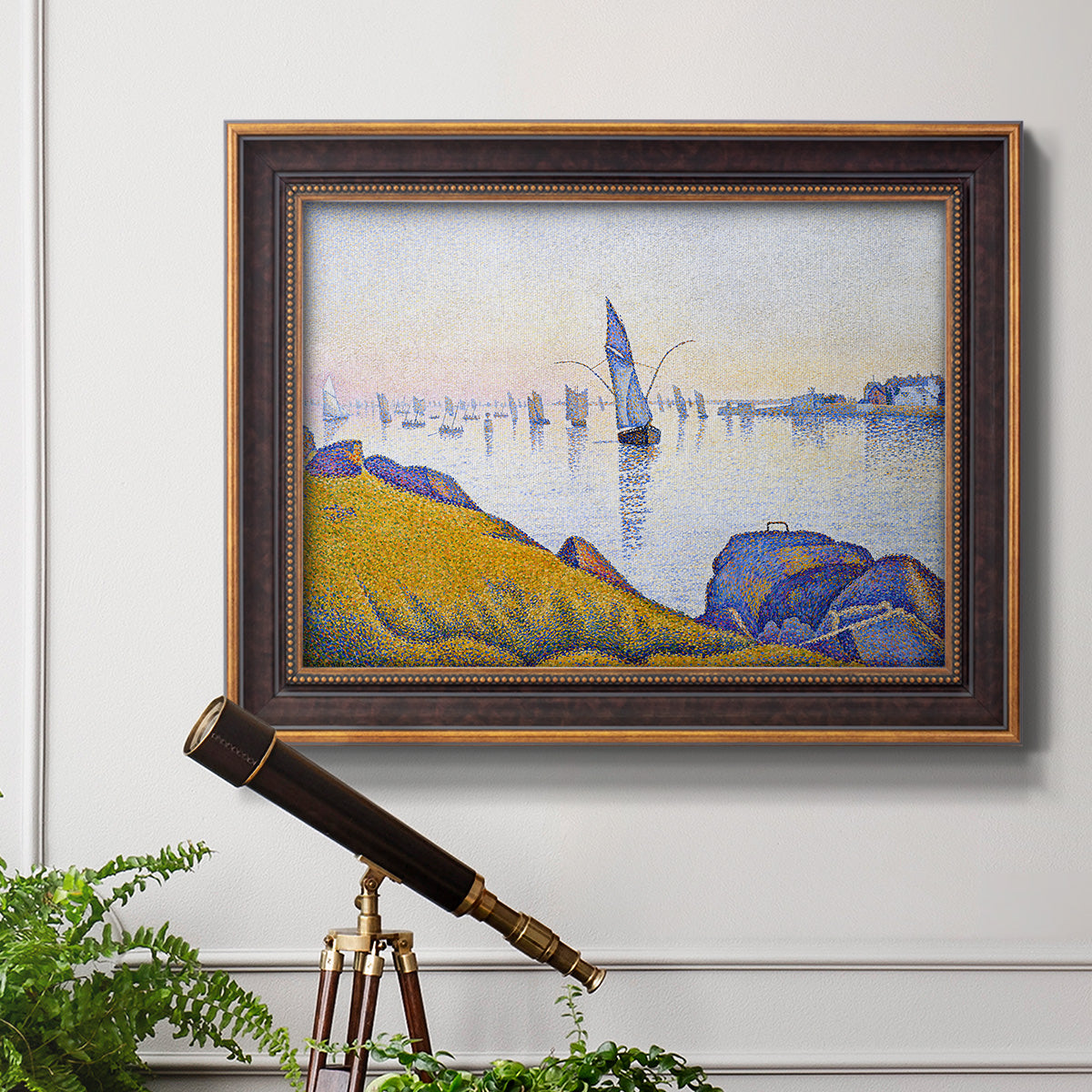 Impressionist coastal harbor at dusk by Paul Signac in an ornate bronzed mahogany wood frame displayed in a light-toned interior setting.
