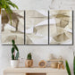Three-panel canvas wall art featuring soft abstract meditative color balance, displayed in a boho-chic entryway above a console table.