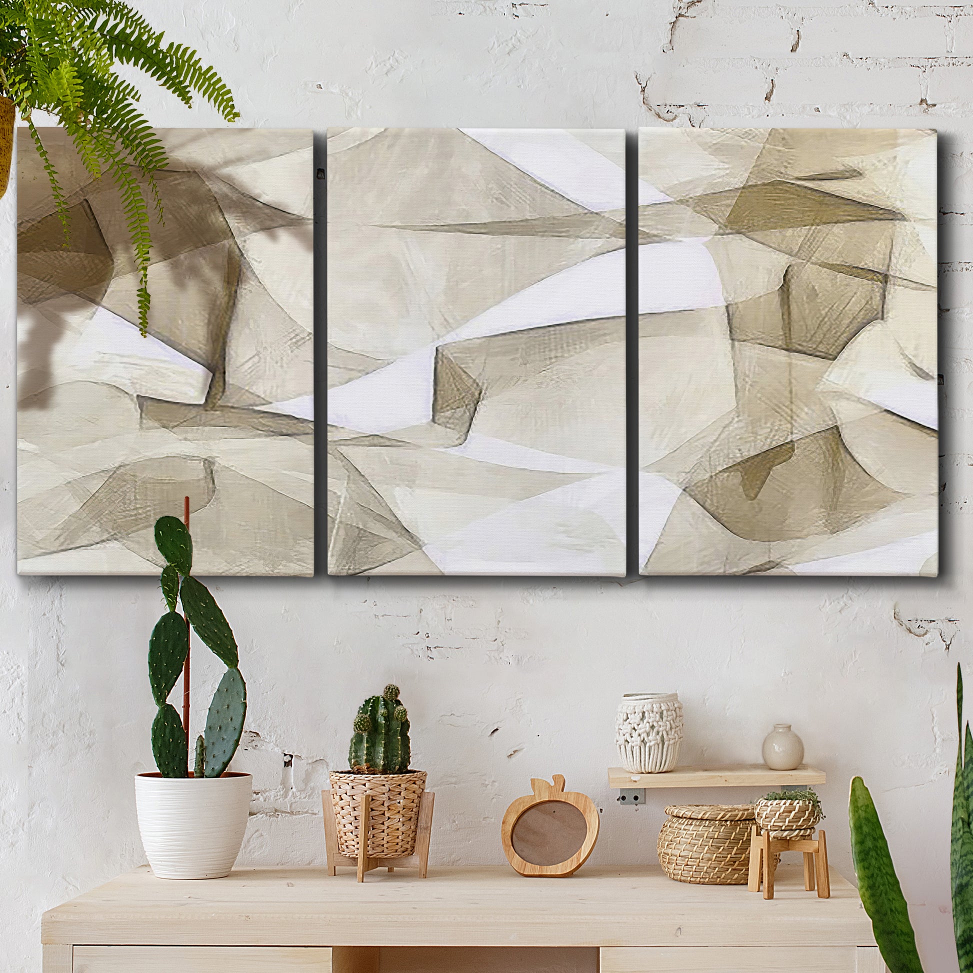 Three-panel canvas wall art featuring soft abstract meditative color balance, displayed in a boho-chic entryway above a console table.
