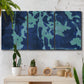 Three-panel canvas wall art featuring abstract floral shapes, displayed in a boho-chic entryway above a console table.