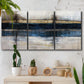 Three-panel canvas wall art featuring abstract blue urban composition, displayed in a boho-chic entryway above a console table.