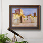 Impressionist Italian village scene by John Singer Sargent in an ornate bronzed mahogany wood frame displayed in a light-toned interior setting.