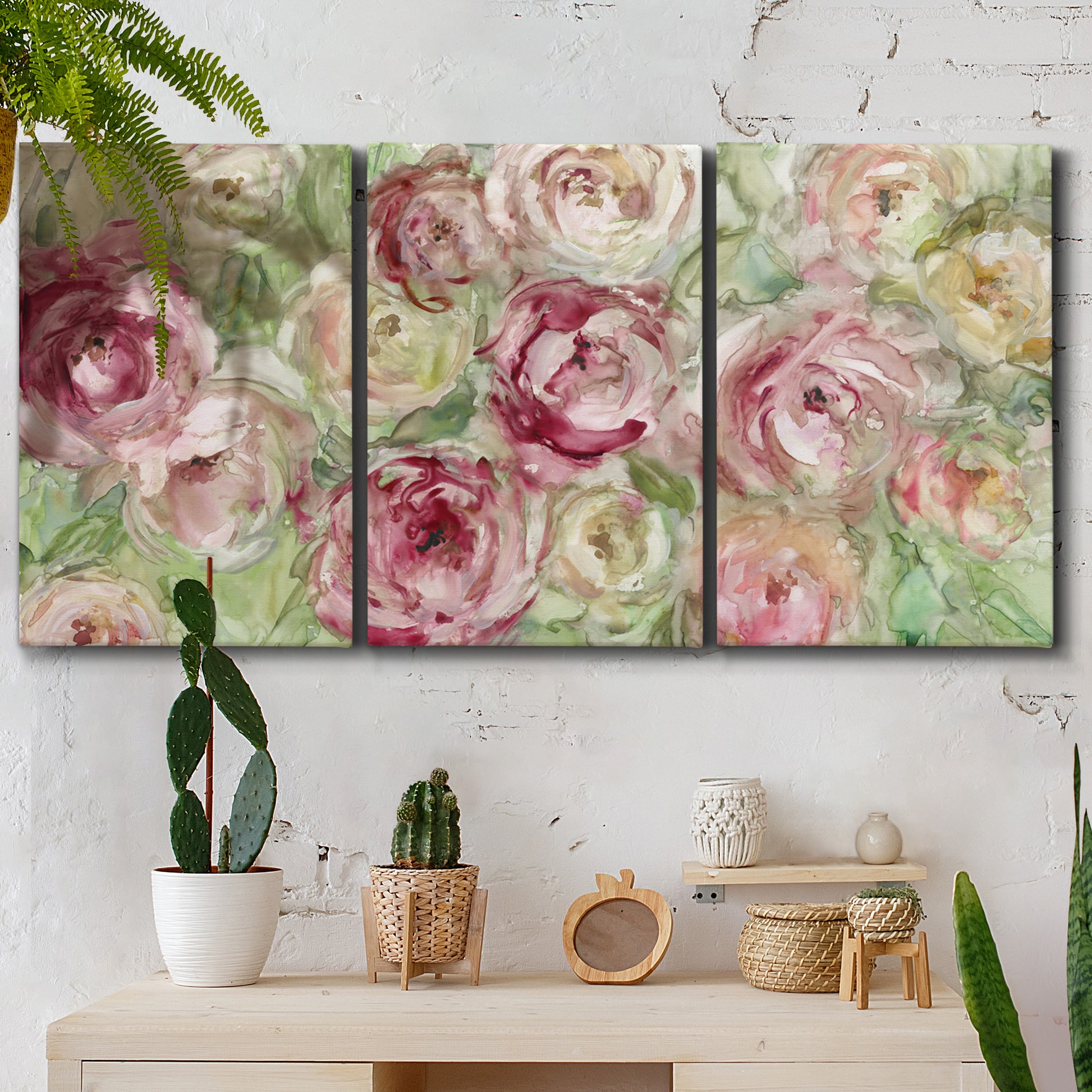 Three-panel canvas wall art featuring blooming climbing rose, displayed in a boho-chic entryway above a console table.