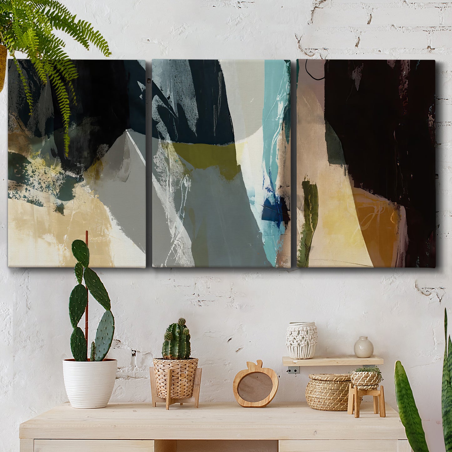 Three-panel canvas wall art featuring layered neutral abstract textures, displayed in a boho-chic entryway above a console table.
