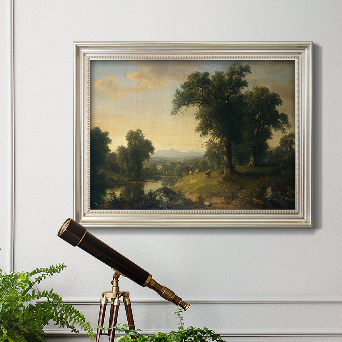 Traditional pastoral landscape painting by Asher Brown Durand in an ornate champagne frame displayed in a light-toned interior setting.