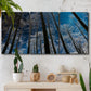 Three-panel canvas wall art featuring night landscape silhouette photography, displayed in a boho-chic entryway above a console table.