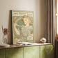 Canvas art print of a vintage advertisement featuring a woman with floral motifs and soft tones styled in a home decor setting.