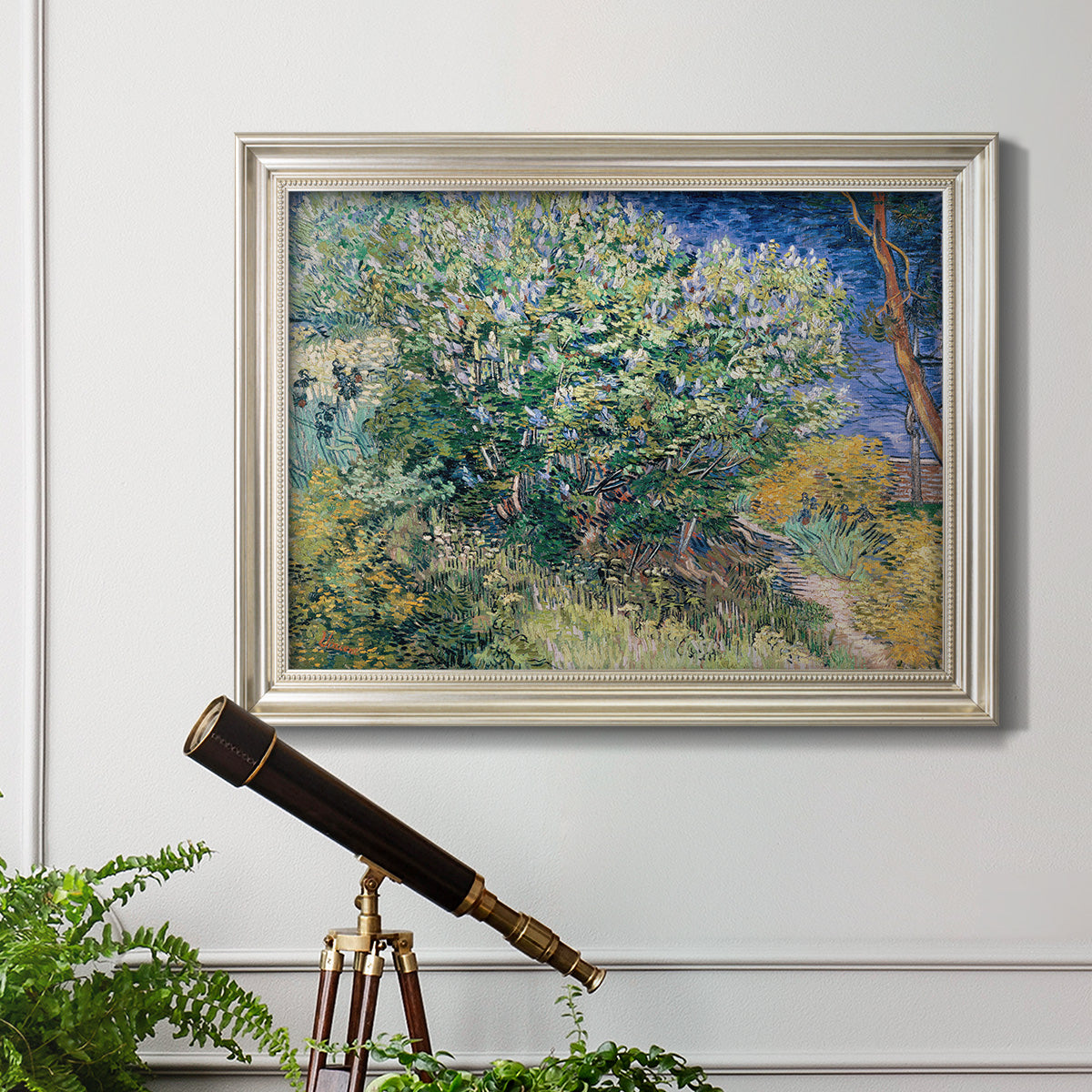 Impressionist lilac flower painting by Vincent van Gogh in an ornate champagne frame displayed in a light-toned interior setting.