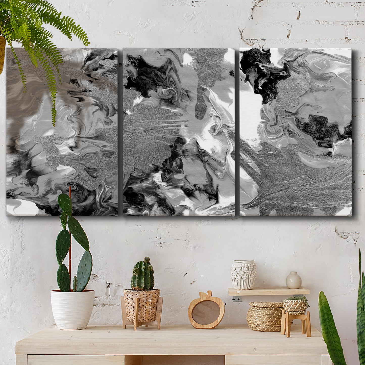 Three-panel canvas wall art featuring abstract marble texture composition, displayed in a boho-chic entryway above a console table.