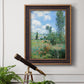 Impressionist pastoral landscape with poppy fields by Claude Monet in an ornate bronzed mahogany wood frame displayed in a light-toned interior setting.