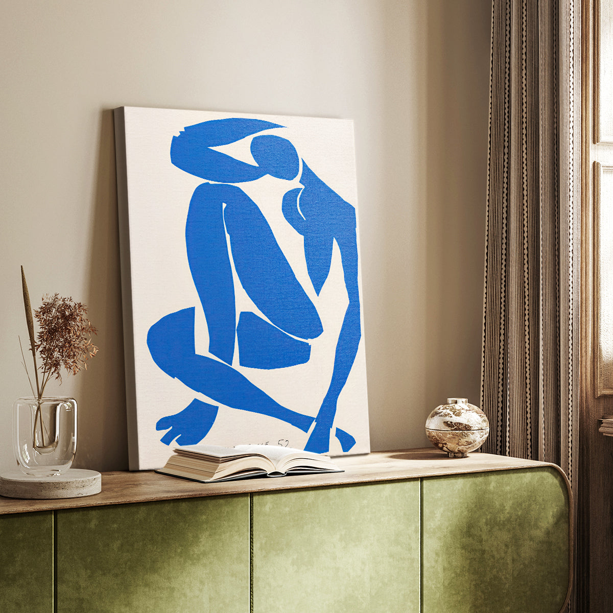Canvas art print of a stylized body formed from flat geometric pieces in deep blue styled in a home decor setting.